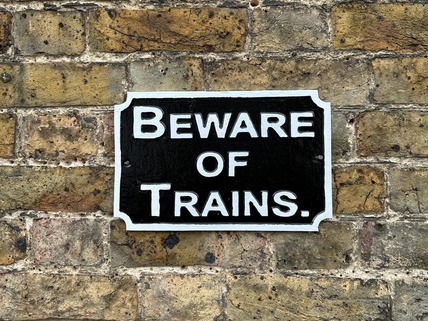 bewae of trains sign